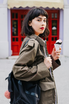 Young Female Model Eating Ice Cream On The Street