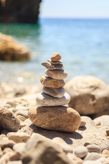 stone tower made of pebbles on the beach