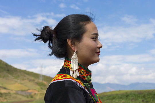 Beautiful Chinese Yi people in traditional costumes  outdoor