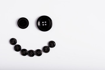 Smile of buttons on a white background. Smiley.