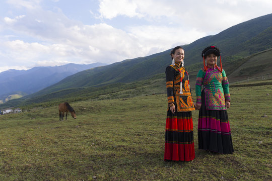Beautiful Chinese Yi people in traditional costumes  outdoor