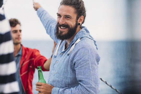 Group of Men Having Fun Time on Sailing Boat