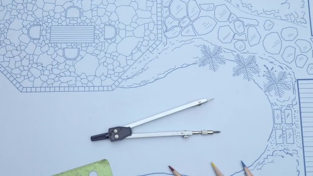 Landscape architect check scale of Blueprint backyard garden and pool design plan.