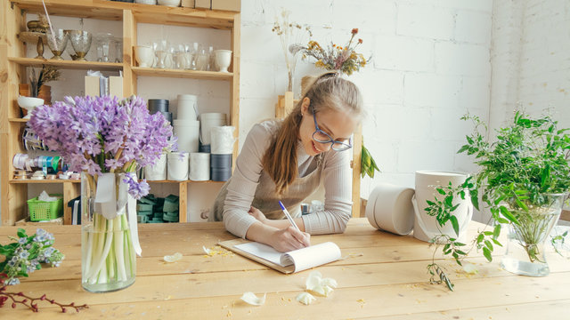 Young woman owner flower shop
