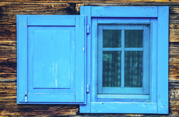 Open blue window wooden old style blinds