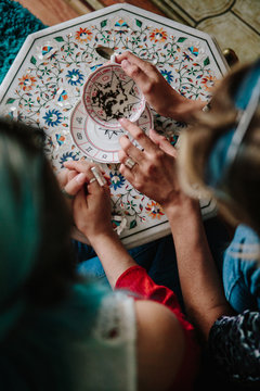 Woman fortune teller reading tea leaves