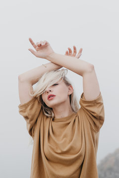 Elegant sensual model with hands up