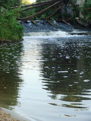 The flow of bubbles after the cascade of the waterfall.
