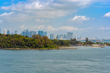 Tropical islands in front of Singapore coastline.