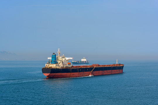 Pilot boat and bulk carrier cargo ship
