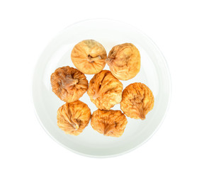 dried fig in white plate on white background