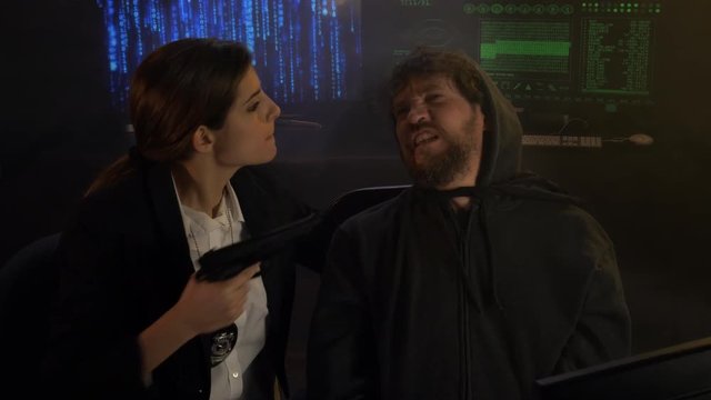 Female police agent hitting and interrogating criminal terrorist hacker