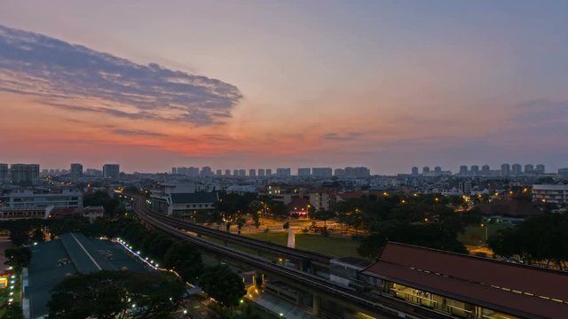 Time lapse of clouds and sky over Eunos housing estate with public MRT mass rapid transportation and auto traffic in Singapore early morning at sunrise 4k