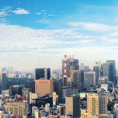 Naklejka premium Aerial skyscraper view of office building and downtown and cityscapes of Tokyo city with blue sly and clouds background. Japan, Asia