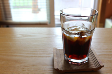 A cup of cold coffee with ice