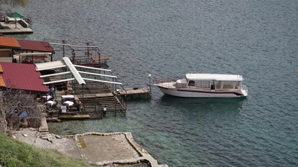 Timelapse with boat by pier in Ohrid Lake, Macedonia
