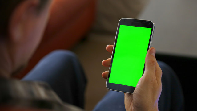 Man Using Smart Phone With Chroma Green Screen