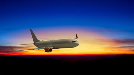 Fototapeta na wymiar An airplane flying above cloud at sunset
