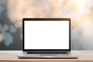 computer laptop with blank screen on wood table