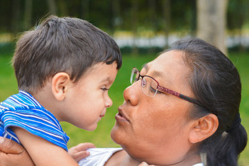 Tender portrait of latin mother and little son.