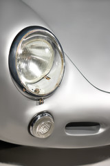 Vintage car headlight close up. Old luxury car classic design. Black and white colors