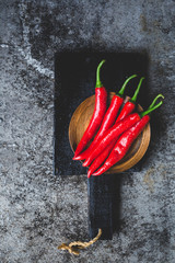 Red chillies on the dark background