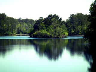 photo of an island in the middle of a beautiful lake