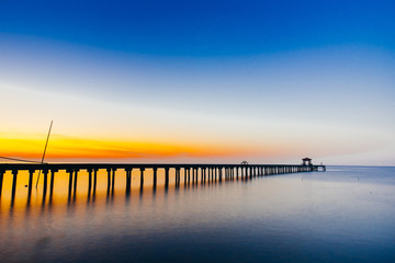 Fototapeta na wymiar Vacation and Holiday concept - Wooden pier between sunset in Samut Prakan, Thailand,Summer, Travel