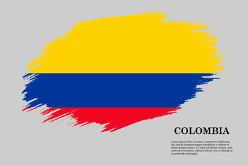 Grunge styled flag Colombia. Brush stroke background