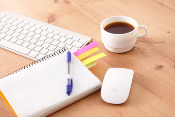 office working desk top view with laptop, notepad and coffee