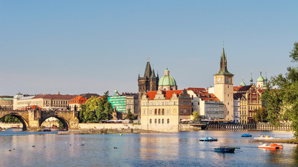 Fototapeta na wymiar Prague. Beautiful summer landscape of the old town and the sights of Prague. View of the Charles Bridge and the Powder Tower.