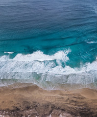 Aerial view on the beach and waves. Beautiful natural landscape from air