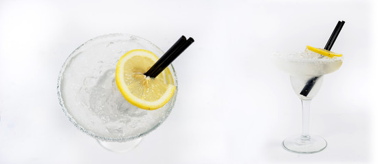transparent cocktail with ice cubes and lemon slice