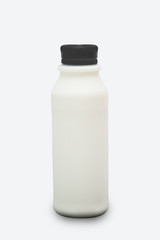 Full milk in plastic bottle isolated on white background with clipping path