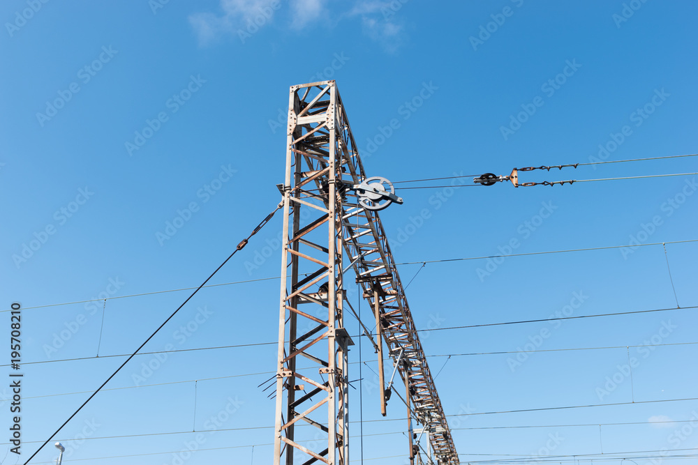 Wall mural train or railway power line support. railway power lines with high voltage electricity on metal pole