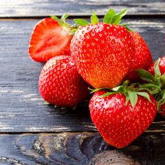 Sweet and fresh strawberry on dark background. Natural food.