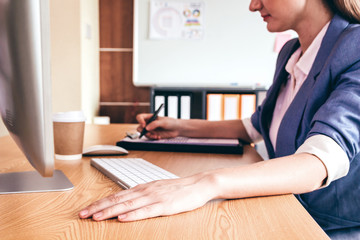 Businesswoman  while working on report documents at modern office