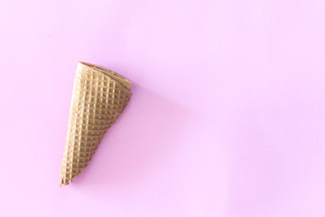 Waffle cone ice cream on pink background