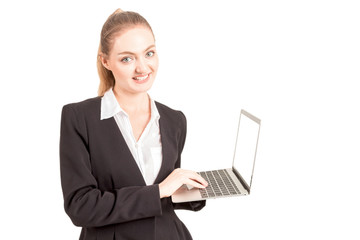 Smiling businesswoman using a laptop computer isolated on white background