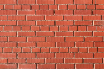 red brick wall with gray cement ligament texture background