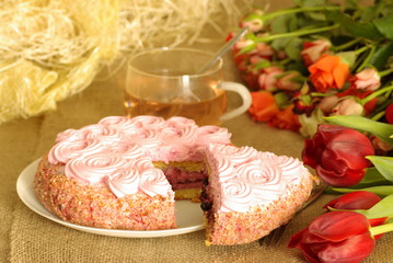 cake and a cup of tea on a bag