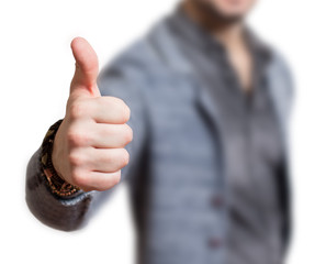 Man's thumb in a symbolic approval gesture thumbs up
