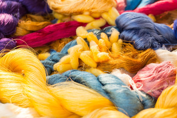 Colorful dye silk thread form Silkworm Cocoon Bombyx mori - obrazy, fototapety, plakaty