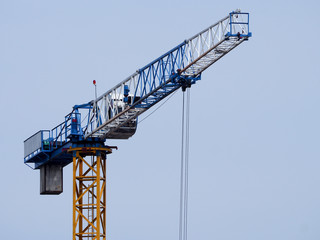 A crane against a blue sky background