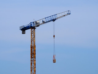 A crane against a blue sky background