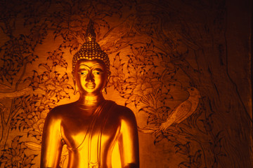 Asian Golden Buddha sign of peace in Thai Temple space for text