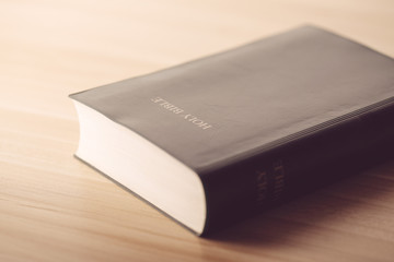 Holy Bible On Wooden Table