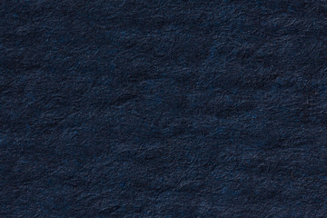 Dark blue crumpled paper background.