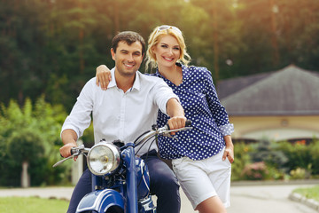 Plakat beautiful couple on retro motorbike