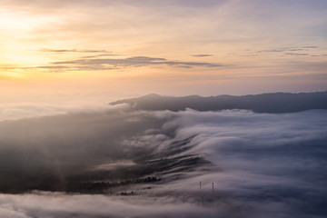 Fototapeta premium The sea of mist cover Cemoro Lawang village during sunrise